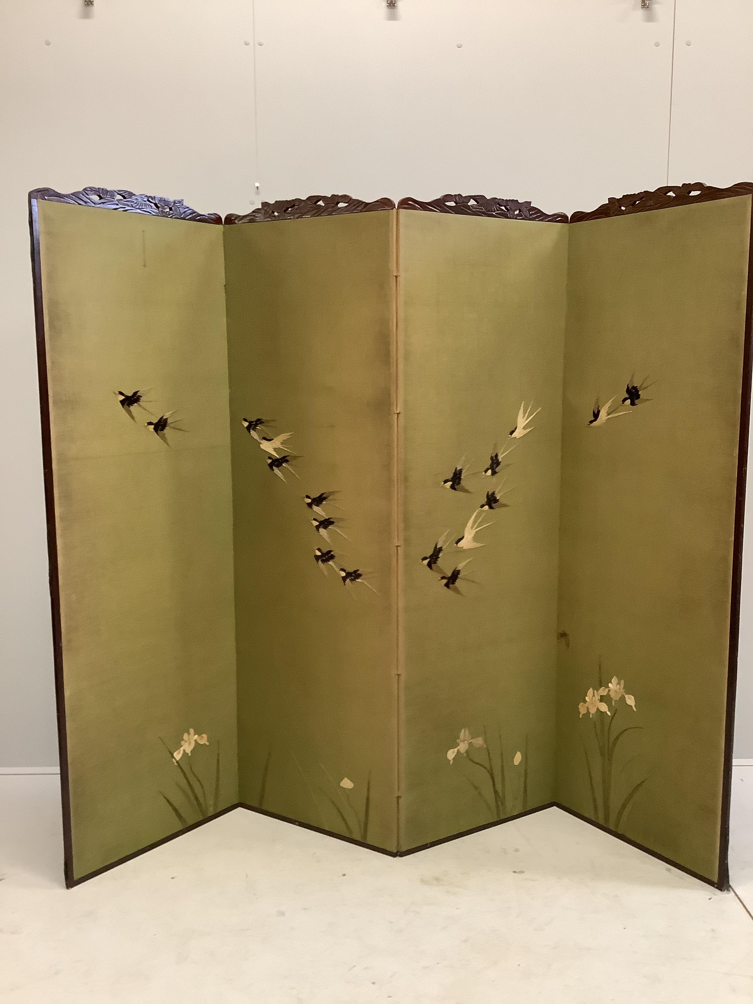 An early 20th century Chinese embroidered four fold dressing screen decorated with swallows, each panel width 55cm, height 170cm